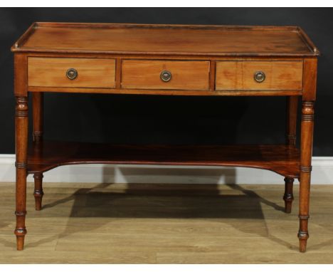 A 19th century mahogany side table, rectangular top with shallow three-quarter gallery above three frieze drawers, ring-turne