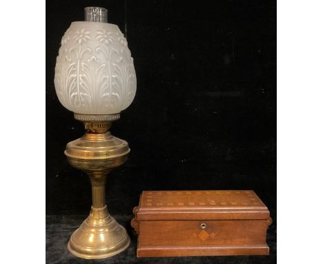 A late Arts and Crafts oak and parquetry rectangular two handled box; an early 20th century brass Duplex oil lamp, moulded op