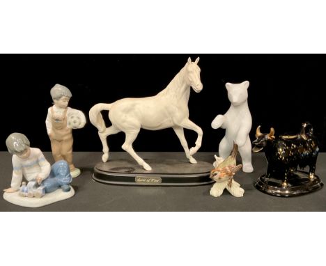 A Royal Doulton horse model, Spirit of the Wind; a continental porcelain model of a bear; two Nao figures; a Staffordshire co