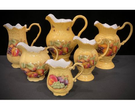 An Aynsley Orchard Gold pattern water jug, printed with ripe fruits, The Crown Flower Pitcher 1999, limited edition, 22.5cm; 