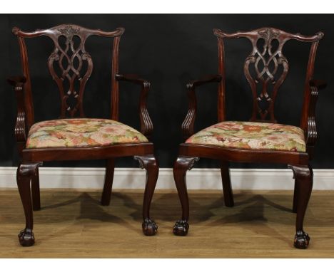 A pair of Chippendale Revival mahogany elbow chairs, 97cm high, 67cm wide, the seat 54cm wide and 45cm deep (2) 