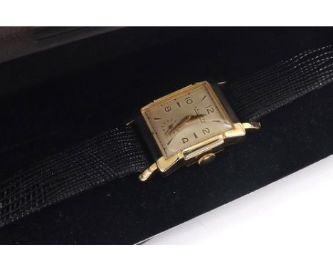Hallmark 14k rectangular cased gentleman's wristwatch, rectangular silvered dial with Arabic numerals, dagger markers, outer 