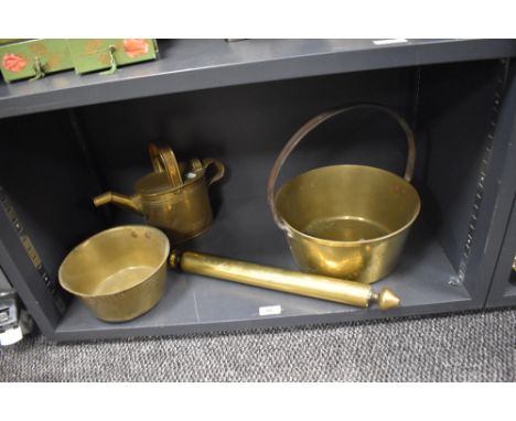 A 19th Century brass preserve pan, a country house brass watering can, a cooking pot, and a Victorian brass rolling pin