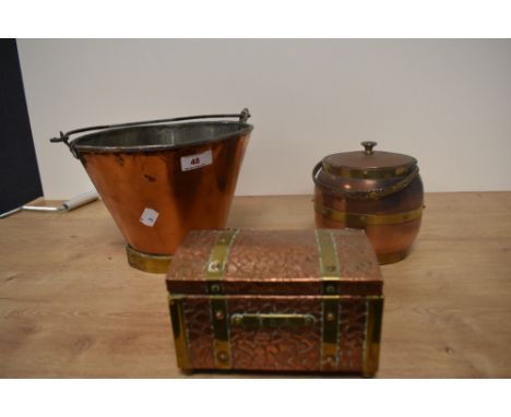 A vintage copper and brass pail, together with a textured copper tea caddy, and a barrel form biscuit jar