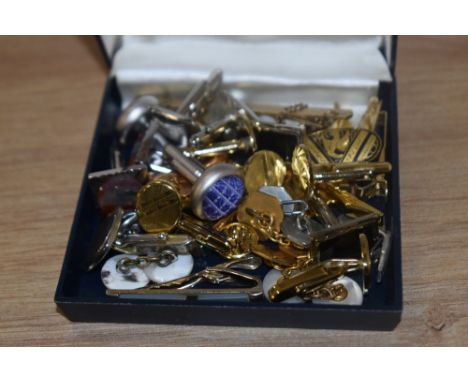 An assorted collection of yellow metal and vintage cuff links