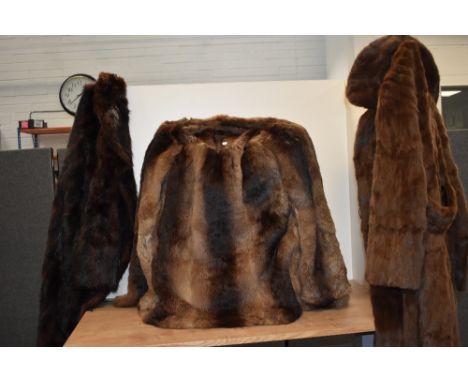 Three vintage fur coats, including mahogany toned mink coat and short rabbit fur jacket.