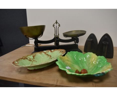 A set of Victorian cast iron and brass balance scales, by W.Avery, two flat irons, and two cabbage form dishes, one by Carlto