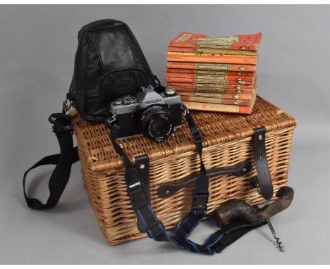 A Wicker Hamper Containing Minolta XG1 Camera, Corkscrew and Various Penguin Paperback Books 