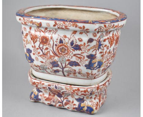 A Late 20th Century Oriental Planter and Stand Decorated in Red and Blue Enamels on White Ground in a Floral Design 