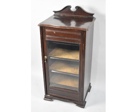 An Edwardian Mahogany Five Shelf Music Cabinet with Swan Neck Cornice and Glazed Door, 47cms Wide 