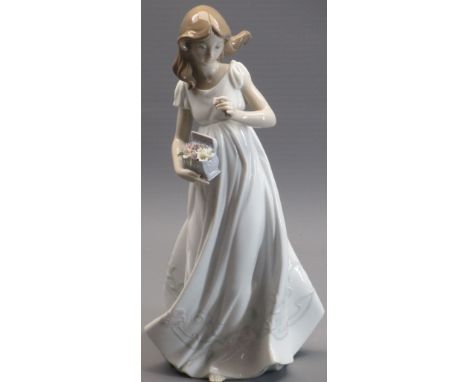 LLADRO - model 6921, 'Treasures of the earth', a young girl collecting flowers, 32cms tall