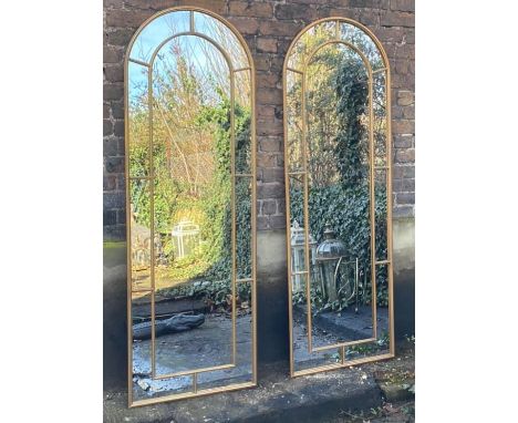 ARCHITECTURAL STYLE MIRRORS, a pair, 180cm x 63cm, metal framed with an arched top. (2) 