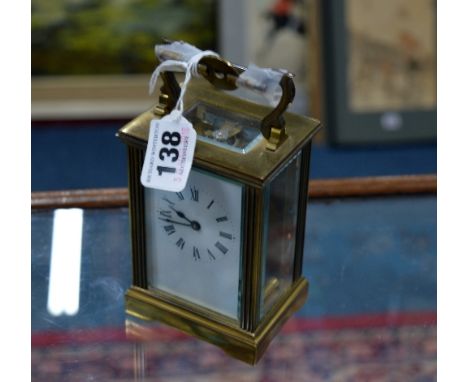 A BRASS CARRIAGE CLOCK (key)
