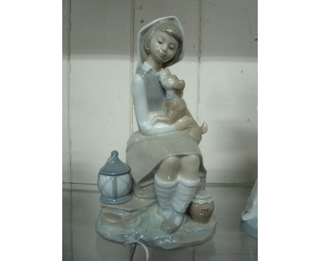 A LLADRO FIGURE GROUP, young girl with dog seated on rock