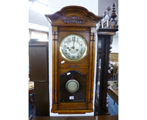 A MAHOGANY CASED WALL CLOCK (key and pendulum)