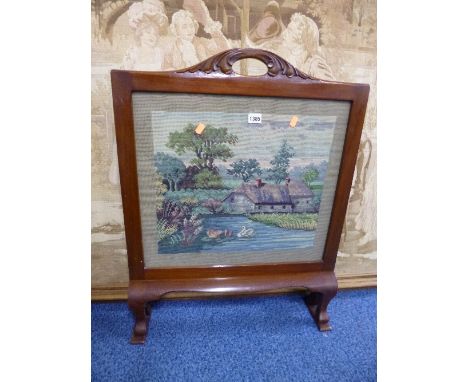 A MAHOGANY FRAMED FIRESCREEN, with inset needlework panel