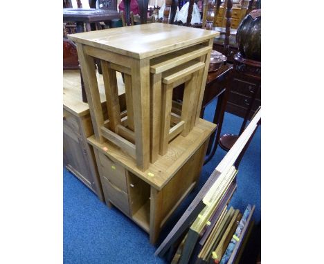 A LIGHT OAK NEST OF THREE TABLES, and a small cabinet with two drawers (s.d.) (2)