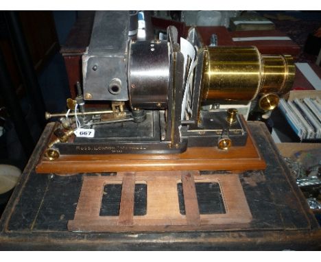 A MAGIC LANTERN, engraved Ross, London, No.1 Model, No.890, on rectangular wooden plinth base, approximately 42cm x 17cm, in 