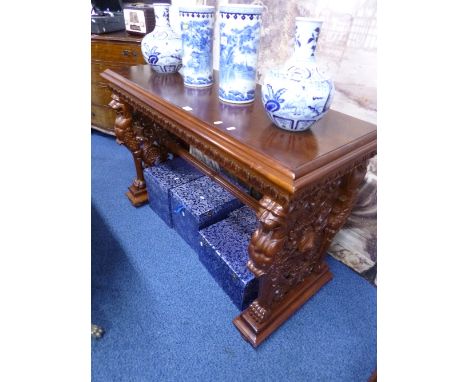 A MODERN MAHOGANY SIDE/CONSOLE TABLE, with heavily carved trestle supports and turned fluted stretcher