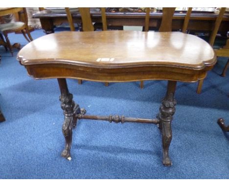 A VICTORIAN MAHOGANY FOLD OVER CARD TABLE, with carved base