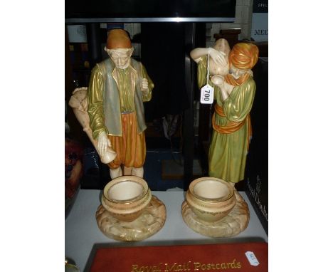 A PAIR OF ROYAL WORCESTER FIGURES, modelled by James Hadley, male Eastern Water Carrier and a female Eastern Water Carrier wi