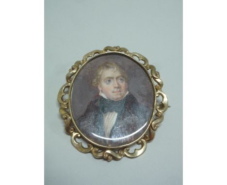 AN OVAL PORTRAIT MINIATURE, on mother of pearl with label verso Sir Walter Scott in yellow metal frame, approximately 6cm x 7