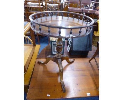 A MODERN MAHOGANY CIRCULAR TRIPOD TABLE, with gallery top and carved base