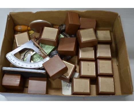 A BOXED OF JEWELLERY ITEMS, to include eighteen ring boxes, two sets of ring sizes, balance scales, treen ring stick - ring c