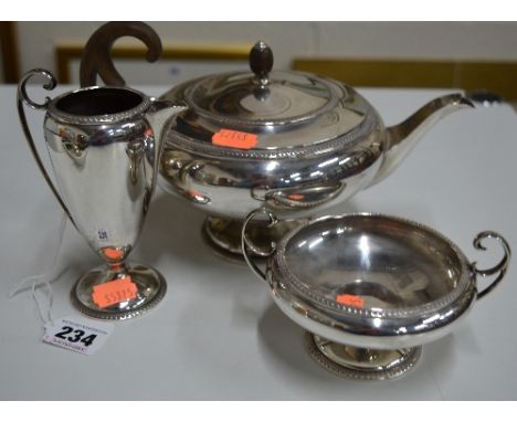 A SILVER THREE PIECE TEA SERVICE, all with strapwork rims, Sheffield 1913, total weight approximately 32.5 ozt (3)