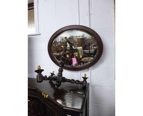 AN OAK FRAMED WALL MIRROR, firescreen and an oak twisted three branch ceiling light (s.d.) (3)