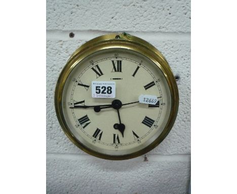 A BRASS SHIPS CLOCK, by F W Elliott Ltd, Croydon (key)