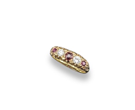A ruby and diamond five stone ring, the three circular-cut rubies and two circular-cut diamonds are set in 18ct gold. London 