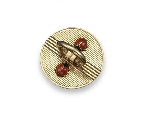 A 9ct gold plug form circular compact by Cartier, the cover with hinged circular handle, fluted decoration and applied with t