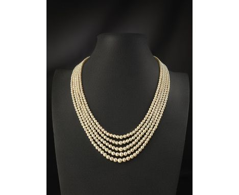A five row natural pearl necklace, the pearls graduate from 2.65 to 7.40mm. 61cm (longest). With a rectagular-shaped white go