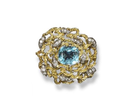 A 1970s aquamarine and diamond set textured ribbon design brooch, the cushion-shaped aquamarine is mounted with scrolls each 