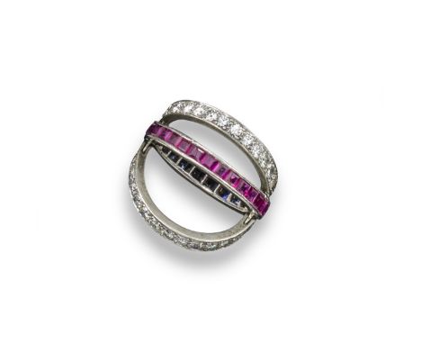 A diamond, ruby and sapphire set double swivel ring, the centre ring is half set with calibre-cut rubies and calibre-cut sapp