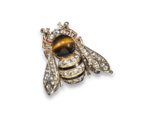 A late 19th century French gold bee brooch, naturalistically designed with a large tiger's eye cabochon and lines of rose-cut