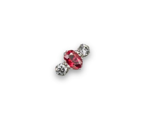 A ruby and diamond three stone ring, the oval-shaped ruby is set with two round brilliant-cut diamonds in 18ct white gold. Si