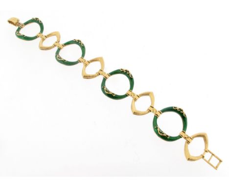 A fancy-link gold bracelet, designed as alternating textured lozenge links and green enamel circular links. Stamped 750 and w