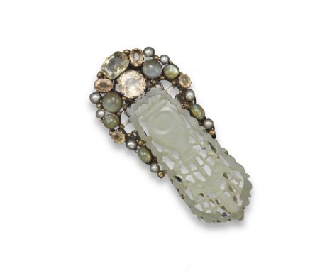 A gem-set clip brooch attributed to Dorrie Nossiter, set with a carved jade plaque within a surround of sapphires, pearls, mo