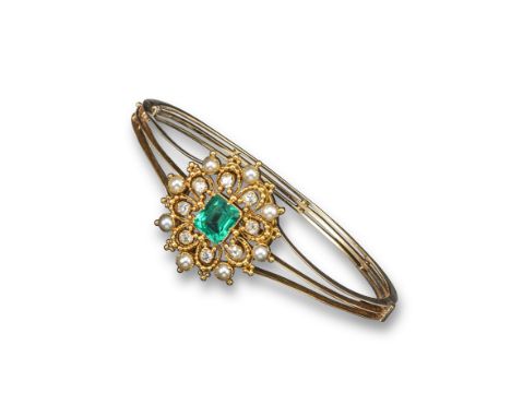 A 19th century emerald diamond and pearl set gold hinged bangle, the detachable centre section is set with a rectangular shap