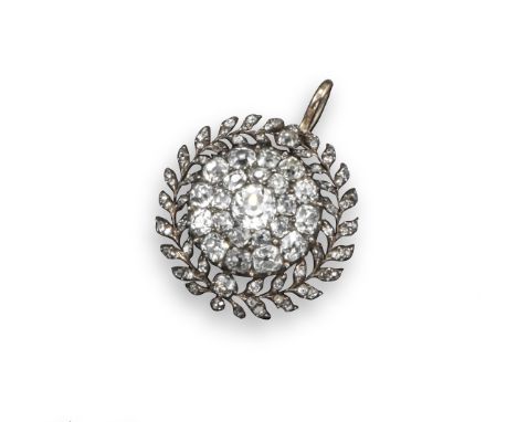 A diamond set circular pendant, centred with an old circular-cut diamond and pavé-set with two rows of smaller old circular-c
