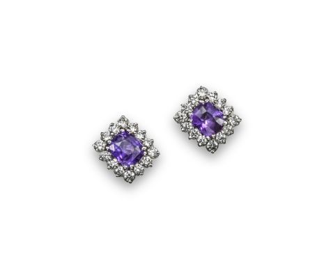 A pair of lilac coloured sapphire and diamond cluster earrings, the oval shaped sapphires are each set within a surround of f