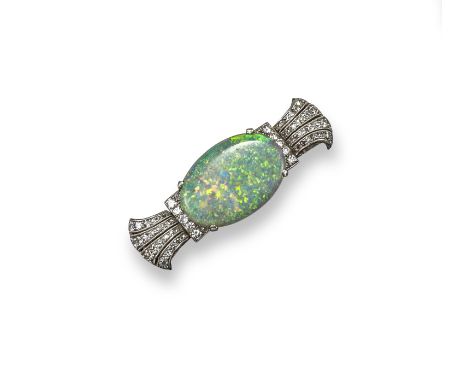 An opal and diamond brooch, the solid white oval opal cabochon, is set within lines of circular-cut diamonds and stylised fle