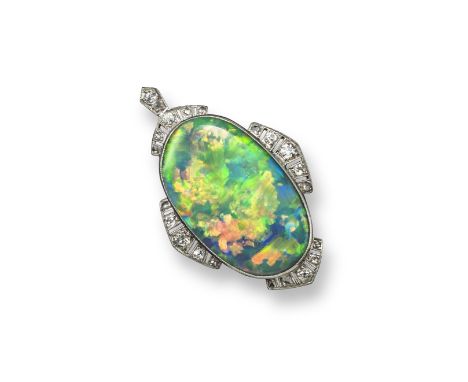 A fine opal and diamond pendant, the oval-shaped Lightning Ridge solid black opal measures 29 x 17 x 5mm deep. White gold mou