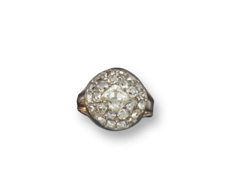 A George III diamond cluster ring, the circular mount centred with a cushion-shaped diamond pavé-set with two borders of smal