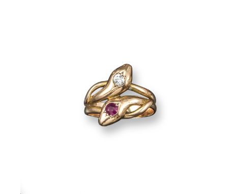 A late Victorian snake ring, the intertwining serpent's heads set with a ruby and a diamond in yellow gold. Size S.