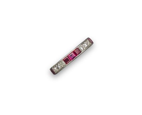 A ruby and diamond full circle eternity ring, alternately-set with three round brilliant-cut diamonds and three calibre-cut r