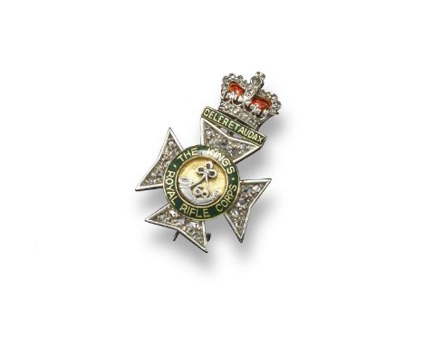 A Regimental brooch for The Kings Royal Rifle Corps, decorated with green and red enamel and pave-set with rose-cut diamonds 