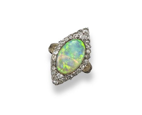 An opal and diamond navette-shaped ring, the solid white opal cabochon is set within a surround of old-cut diamonds in platin